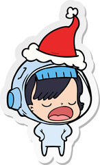 hand drawn sticker cartoon of a astronaut woman explaining wearing santa hat