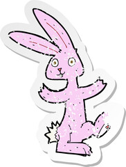 retro distressed sticker of a cartoon rabbit