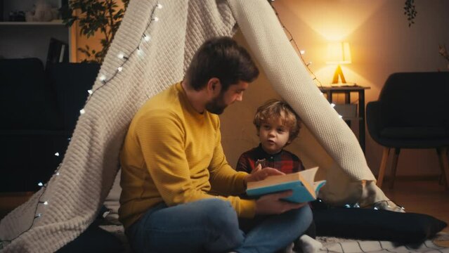 Young Dad And Adorable Son Reading Book Together, Child Upbringing, Parenting