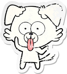 distressed sticker of a cartoon dog with tongue sticking out