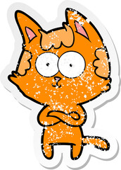 distressed sticker of a happy cartoon cat with crossed arms