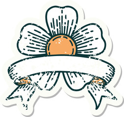 worn old sticker with banner of a flower