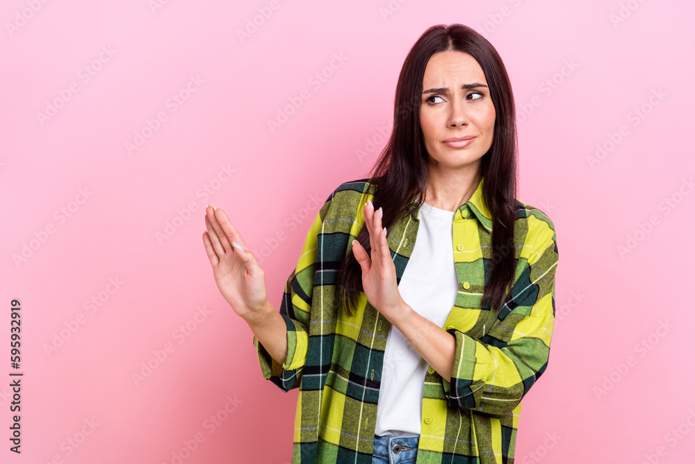 Wall mural Photo of unsatisfied person look arms palms show stop gesture empty space isolated on pink color background