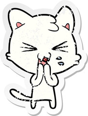 distressed sticker of a cartoon hissing cat