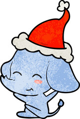 cute hand drawn textured cartoon of a elephant wearing santa hat