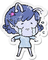 distressed sticker of a cartoon crying alien girl