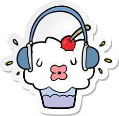sticker of a cartoon cupcake listening to music