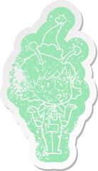 quirky cartoon distressed sticker of a alien girl wearing santa hat