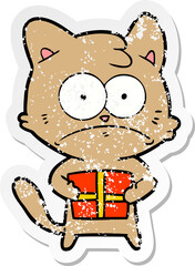 distressed sticker of a cartoon cat with present