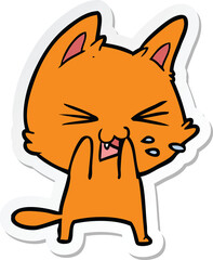 sticker of a cartoon cat hissing