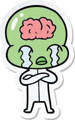 sticker of a cartoon big brain alien crying
