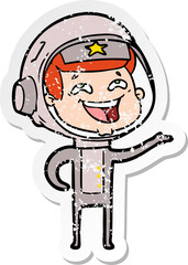distressed sticker of a cartoon laughing astronaut