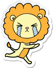 sticker of a cartoon crying lion