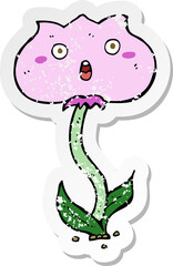 retro distressed sticker of a cartoon shocked flower
