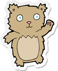 sticker of a cartoon waving teddy bear
