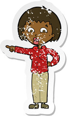 retro distressed sticker of a cartoon pointing woman