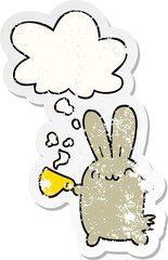 cute cartoon rabbit drinking coffee with thought bubble as a distressed worn sticker