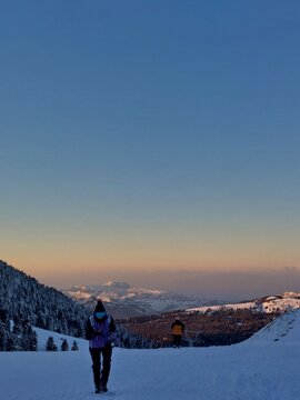 Sunset on a snowing mountain