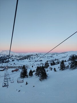 Sunset on a snowing mountain