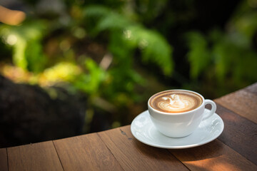 Background Coffee cup and beans on old kitchen table. Coffee cup in coffee shop.