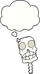cartoon spooky skull with thought bubble