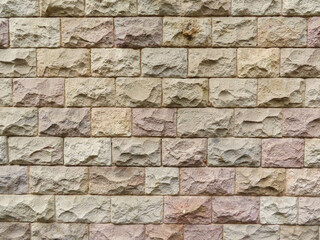 Textured stone sandstone surface. Close up image bricks