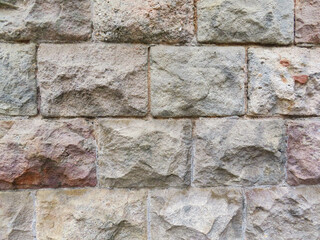 Textured stone sandstone surface. Close up image bricks
