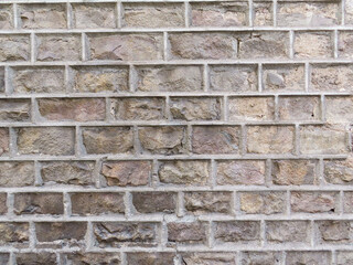 Textured stone sandstone surface. Close up image bricks