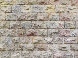 Textured stone sandstone surface. Close up image bricks