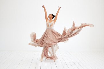 Nothing but dance. Full length shot of an attractive young female ballerina practicing in her dance studio.