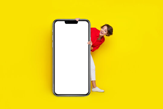 Full length photo of positive crazy person look interested big empty space display isolated on yellow color background