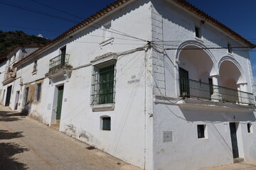 Alajar, Huelva, Spain, April 10, 2023: Typical white house with terrace in Las Palomitas street, Alajar, Huelva, Spain