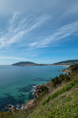 Fototapeta na wymiar View of the cape of Finisterre and the village of Fisterra, vertical photo