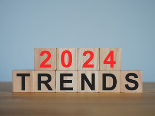 On a wooden cube with a trends 2024, the beginning of the new year. Trends of change, investment, starting a new business