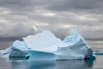 Impressive iceberg with blue ice in Antarctica, scenic landscape in Antarctic Peninsula  © Mark Barzman