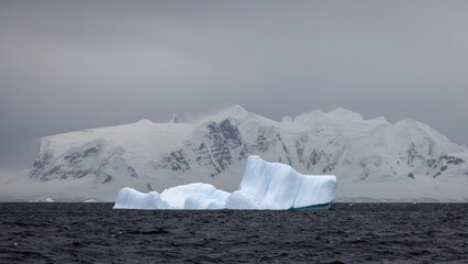 Impressive iceberg with blue ice in Antarctica, scenic landscape in Antarctic Peninsula	