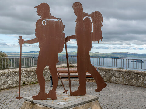 Pilgrim monument in the historic center of Montefiascone, Italy, with Bolsena lake in the background