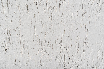 The surface of the wall with the texture of decorative plaster. 