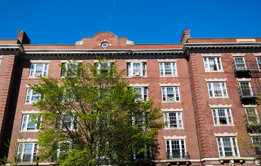 Fototapeta premium Old brick apartment building in Cambridge, Massachusetts.