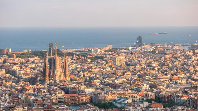 Barcelona Spain time lapse 4K, high angle view city skyline day to night timelapse from Bunkers del Carmel