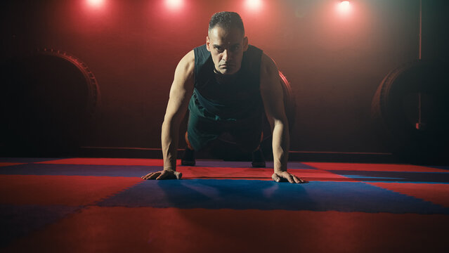 Athlete performs push-ups in the gym