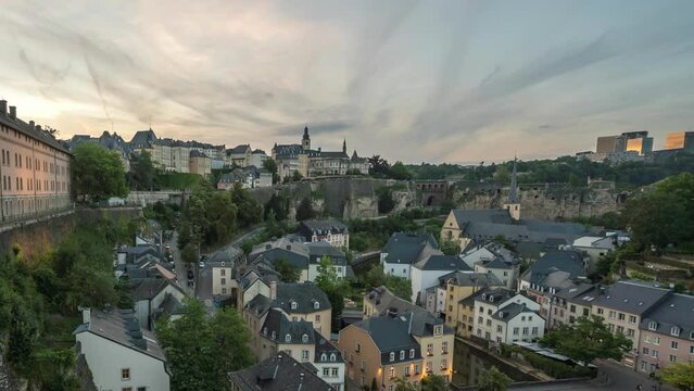Grand Duchy of Luxembourg time lapse 4K, city skyline day to night timelapse at Grund along Alzette river in the historical old town of Luxembourg