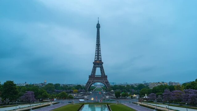 Paris France time lapse 4K, city skyline night to day timelapse at Eiffel Tower and Trocadero Gardens