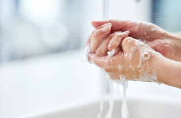 Clean hands. Healthier body. Closeup shot of a woman washing her hands.