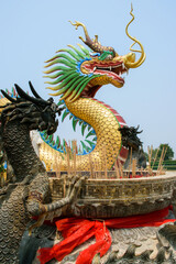 Fototapeta na wymiar Dragons with incense at Chinese temple wat Hyua Pla Kang in Chiang Rai