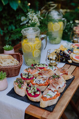 Dessert buffet at small wedding reception outside in the backyard.