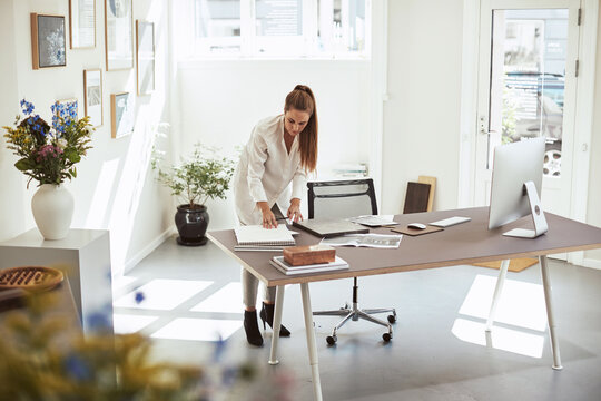 Young female architect sketching ideas in a notebook
