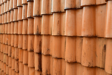Old orange roof tiles with water stains dirt