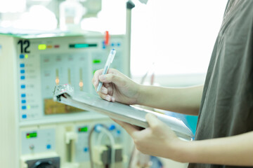 The specialist are checking continuous renal replacement therapy equipment and injection pump and...