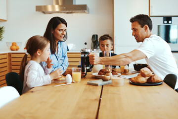 Smiling family enjoying a healthy breakfast